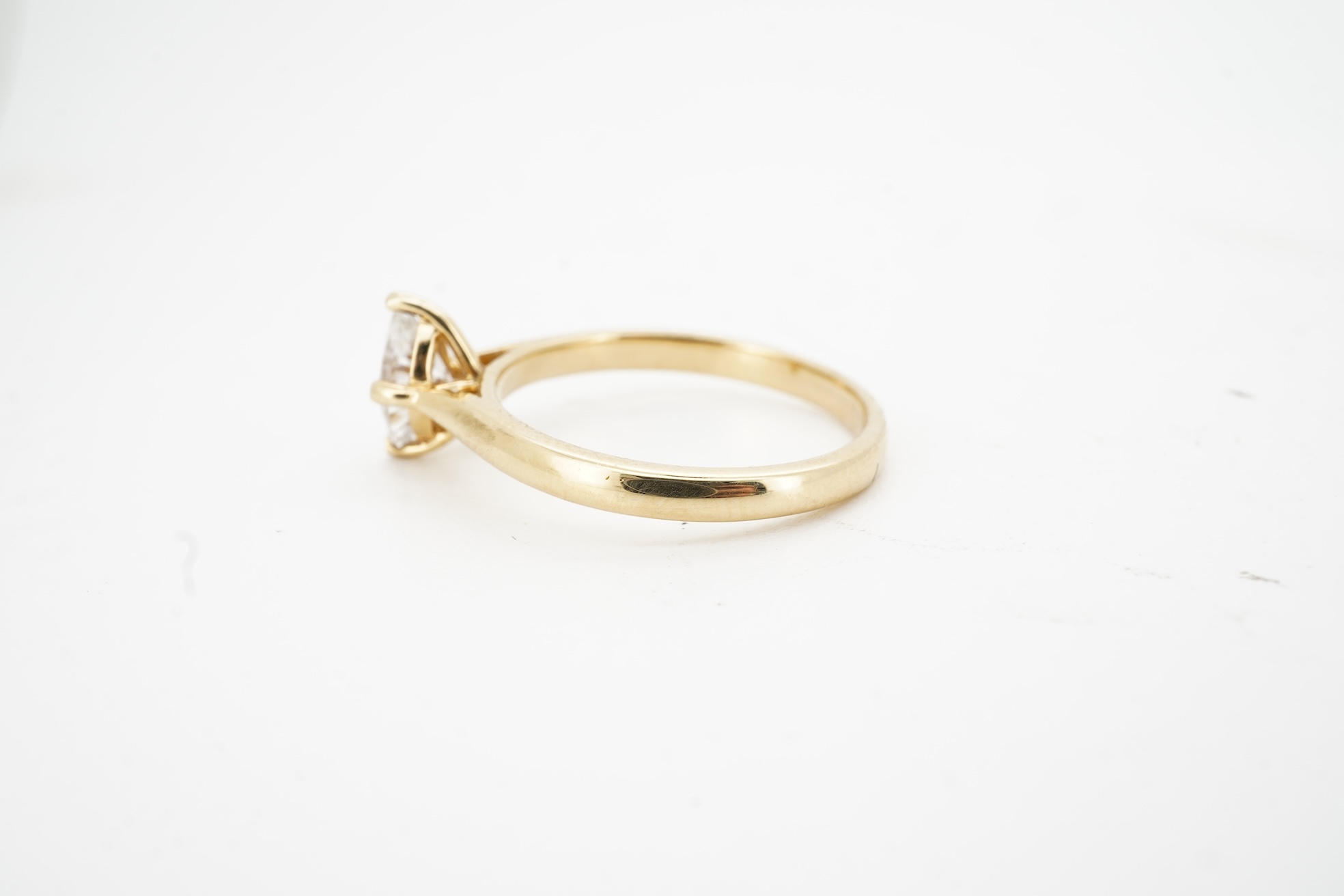 A diamond ring, claw-set with a marquise-shaped diamond weighing approximately 0.70 carats, mounted in gold, size L1/2, gross weight approximately 3 grams